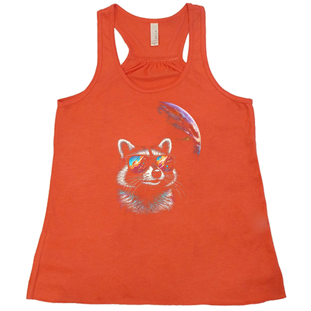Coral colored flowy tank with a raccoon looking into space graphic on it