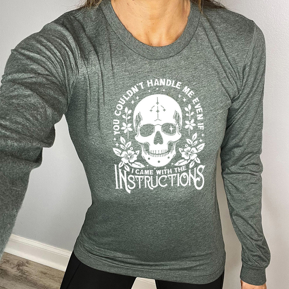 heather forest long sleeve shirt with the text "You Couldn't Handle Me Even If I Came With The Instructions" on it, with the graphic of a skull, with some flowers around it