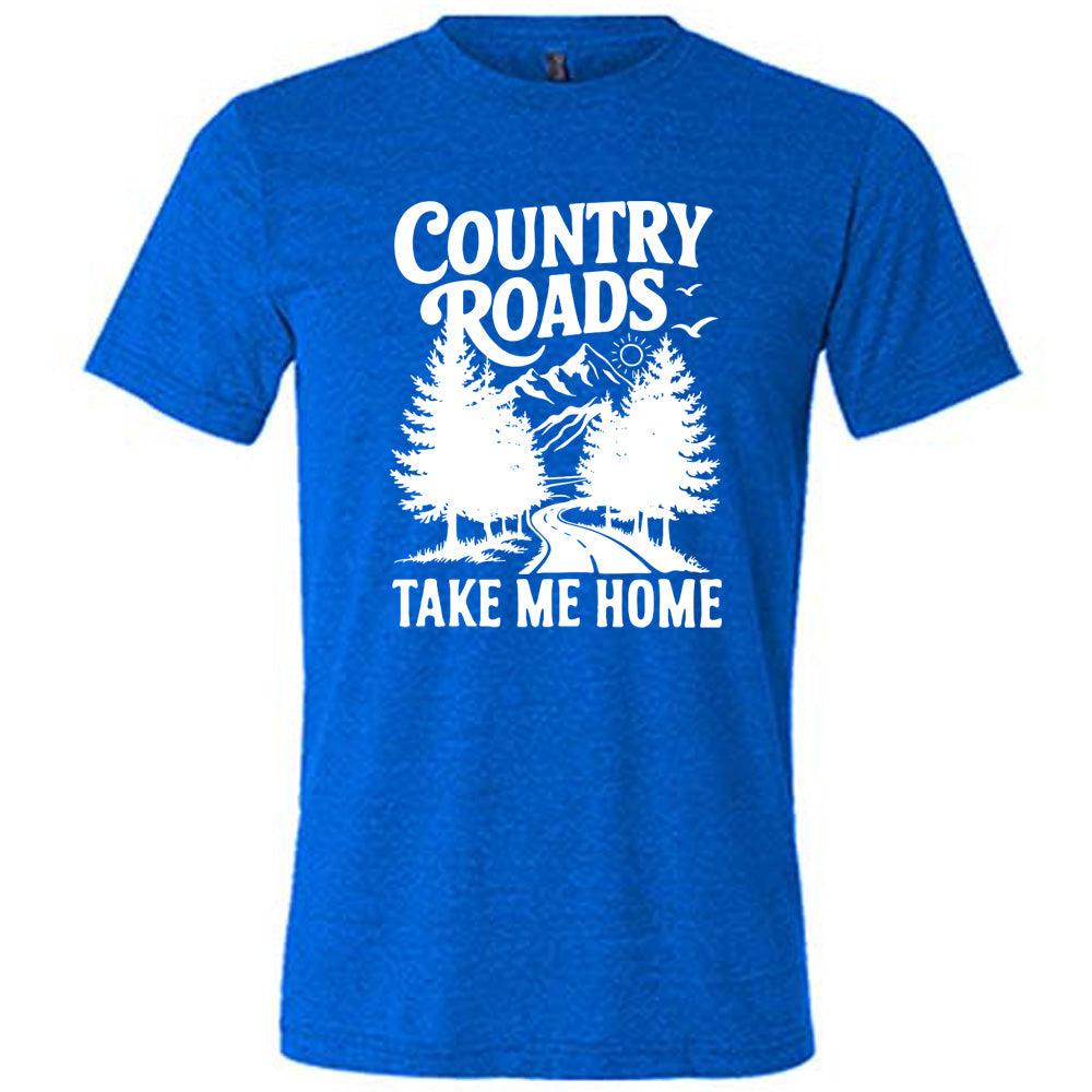blue unisex tee with the words "country roads take me home" on it, and the graphic of a road going through tall trees, with mountains beyond, and the sun