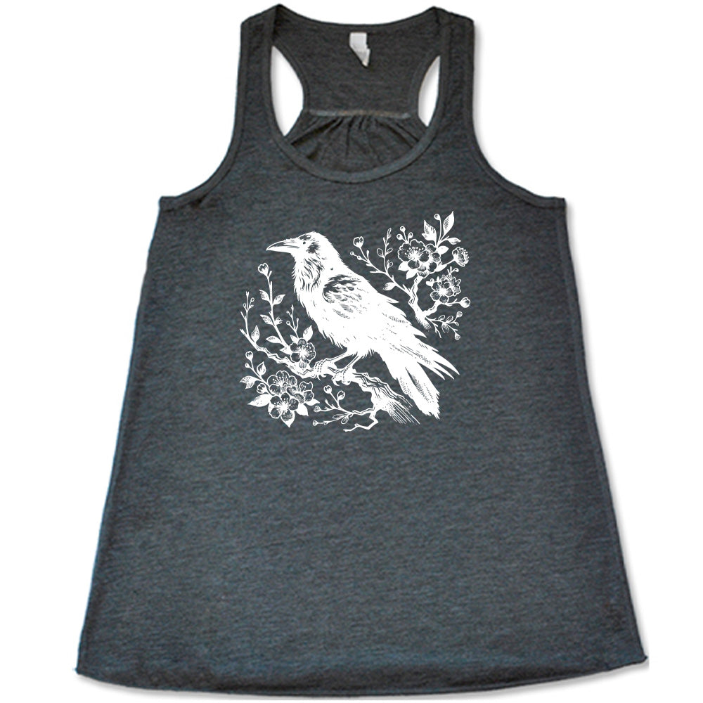 Grey colored flowy tank with crow on flowery branch graphic on it