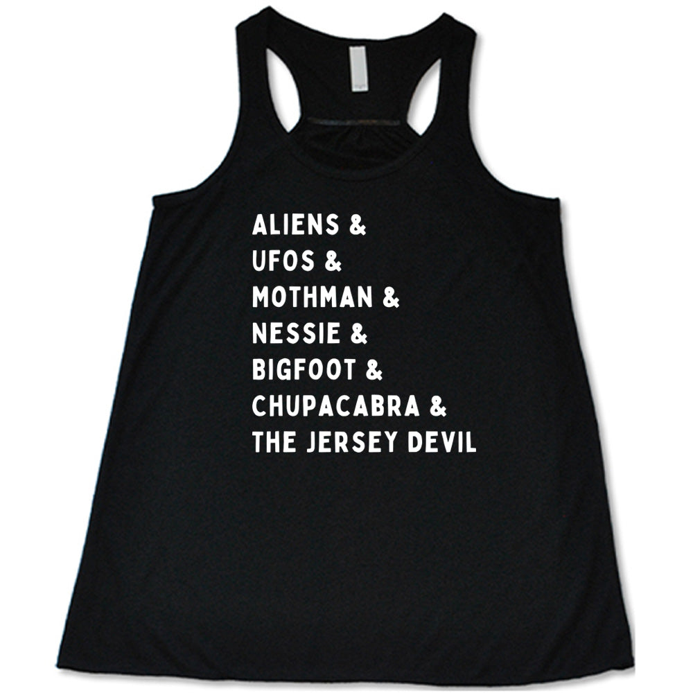 Black colored flowy tank with graphic on it that says "ALIENS & UFOS & MOTHMAN & NESSIE & BIGFOOT & CHUPACABRA & THE JERSEY DEVIL"