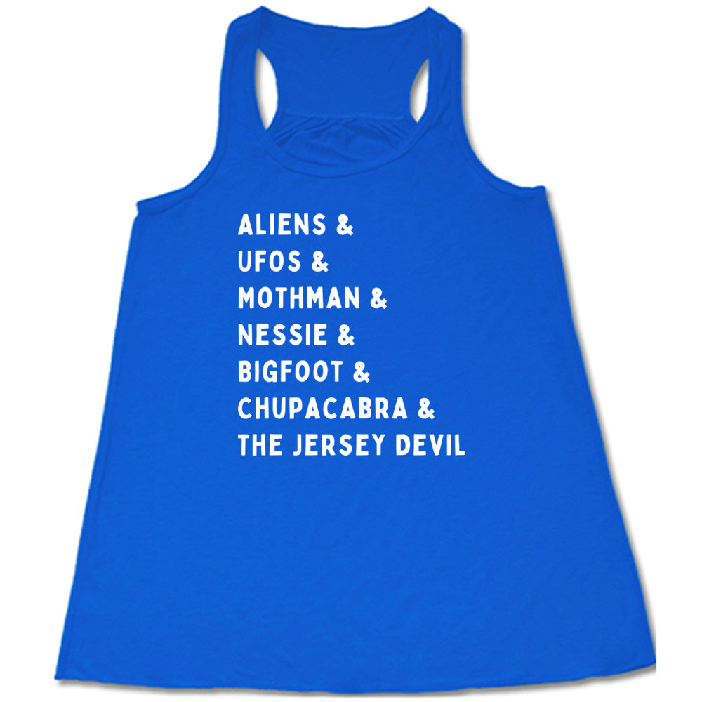 Blue colored flowy tank with graphic on it that says "ALIENS & UFOS & MOTHMAN & NESSIE & BIGFOOT & CHUPACABRA & THE JERSEY DEVIL"
