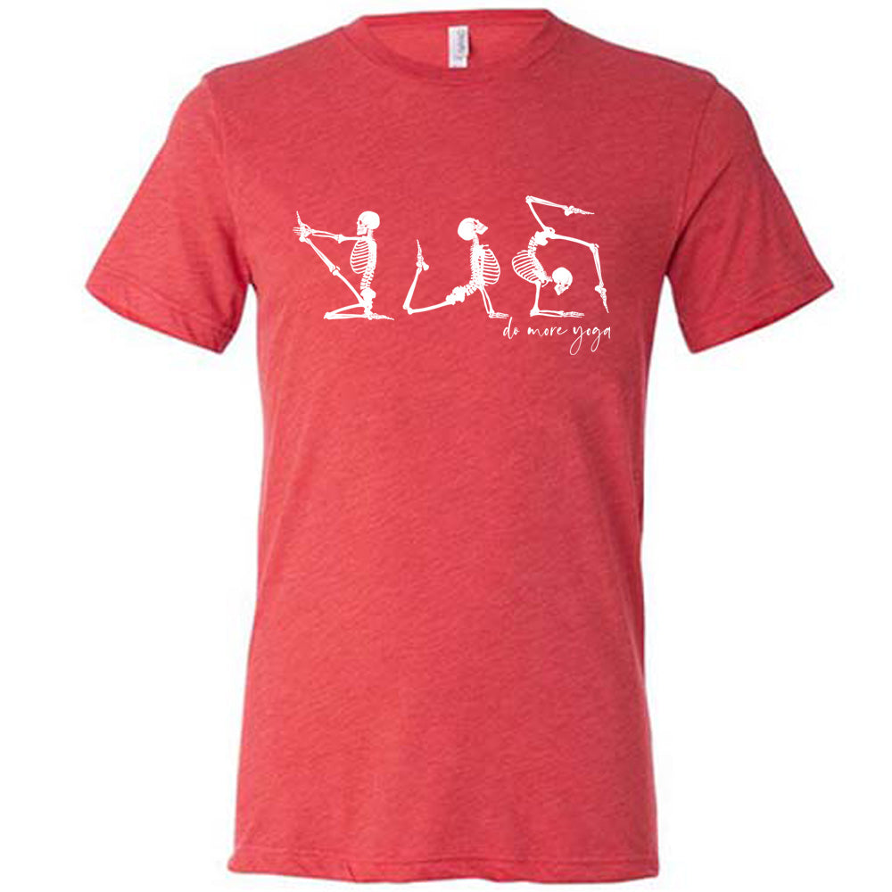 red unisex tee with three skeleton graphics doing yoga, with the small words underneath saying "do more yoga"