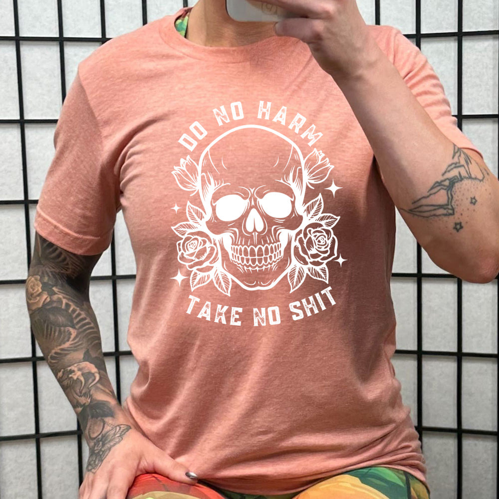 peach shirt with the text "Do No Harm, Take No Shit" on it