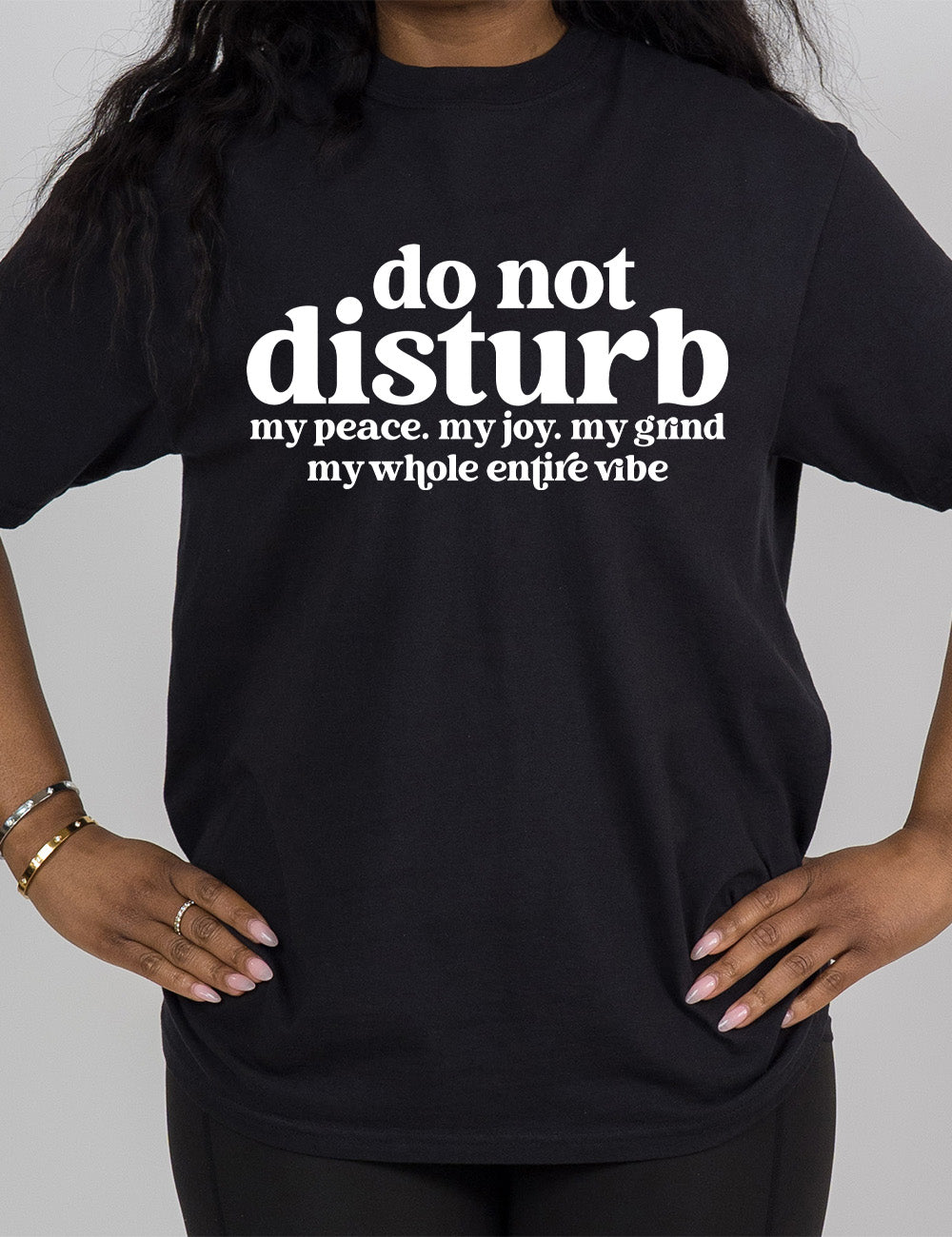 black modern tee with large words on it saying "do not disturb" followed by the smaller words "my peace. my joy. my grind my whole entire vibe"