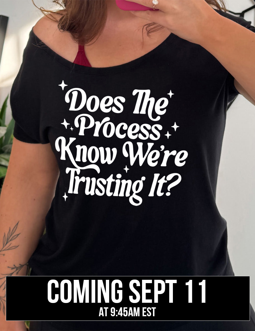 black slouchy tee with the words on it saying "does the process know we're trusting it?" with stars accenting around coming September 11th