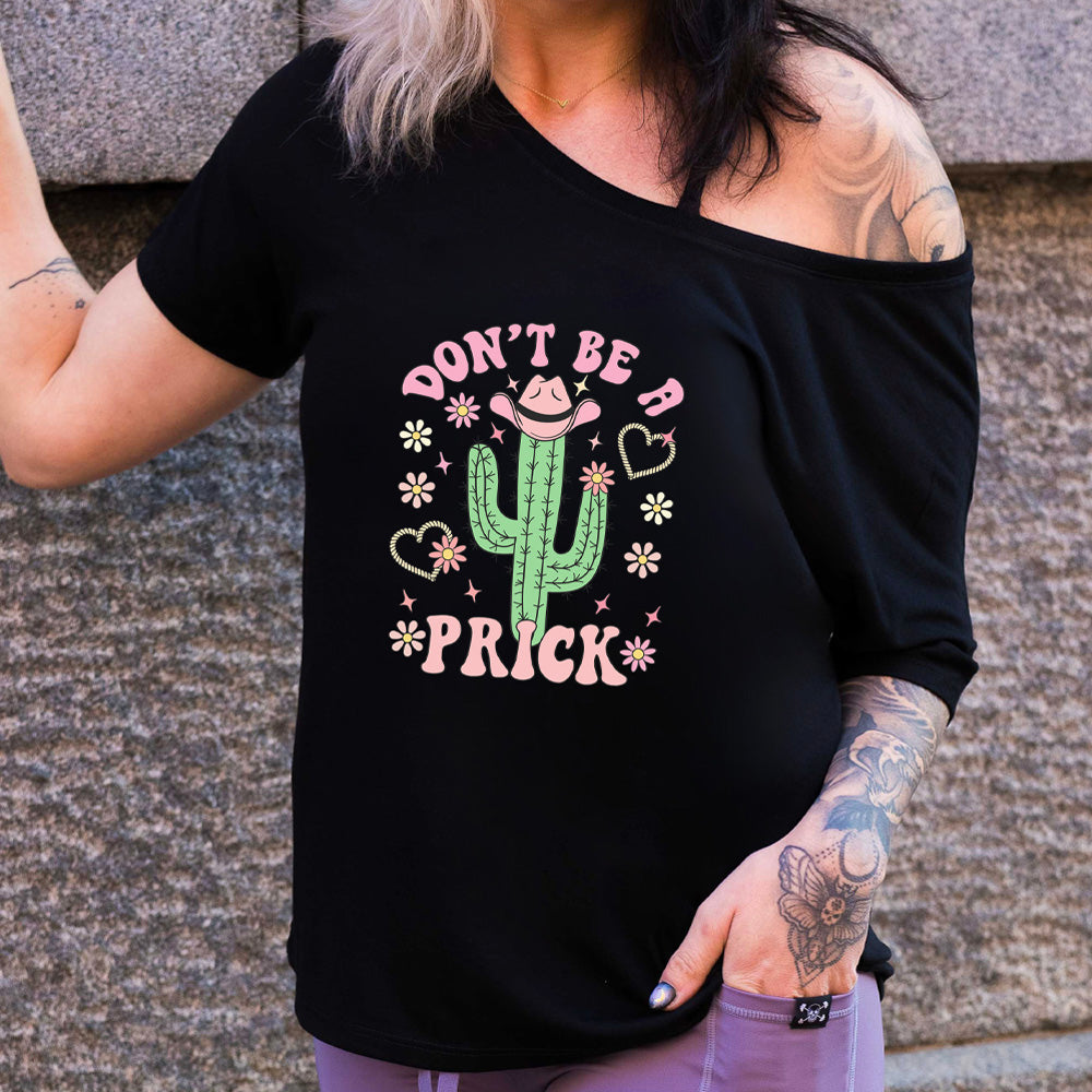 Black slouchy shirt with a cactus wearing a cowboy hat graphic on it that says "Don't Be A Prick"