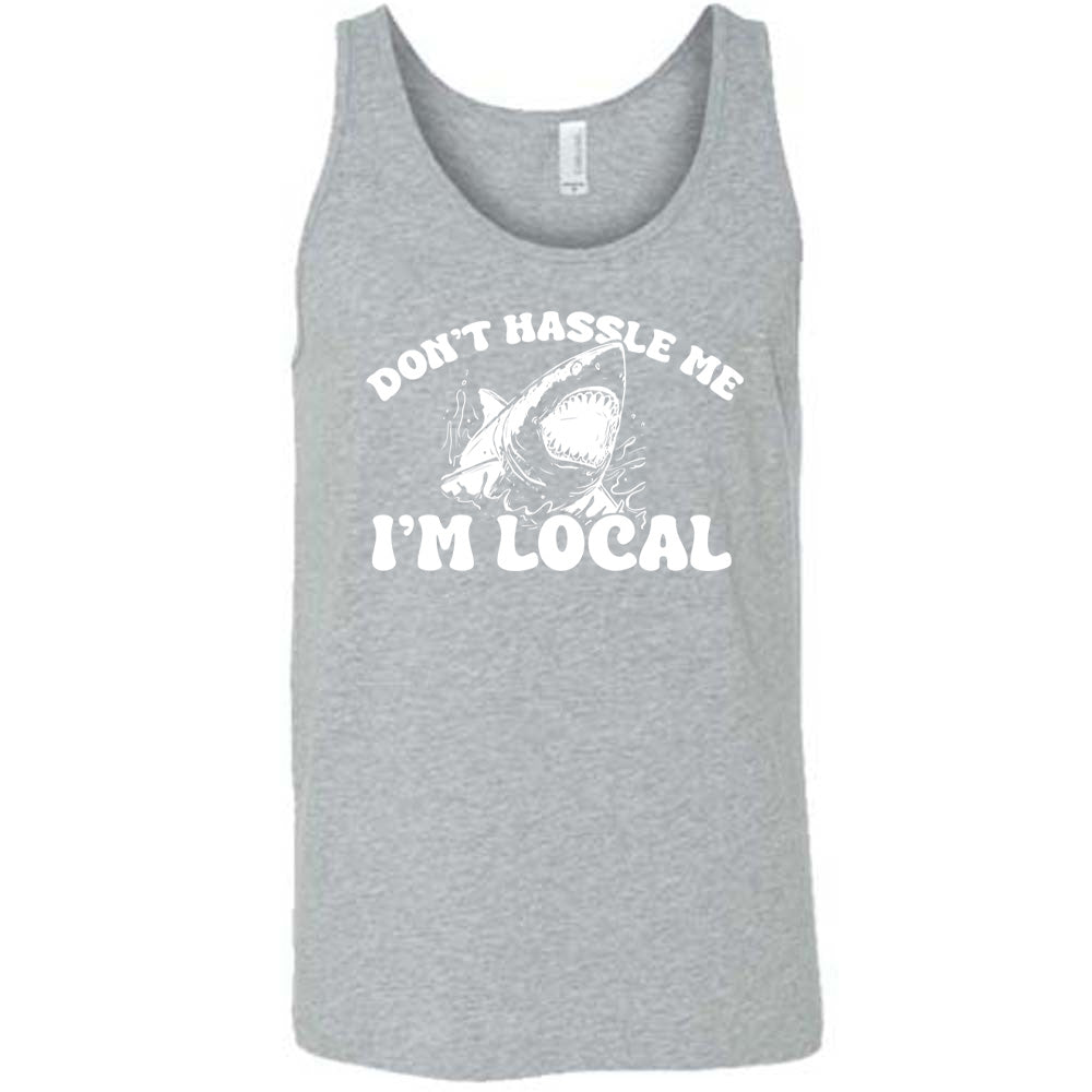 Grey colored tank with a shark graphic on it that says "Don't Hassle Me I'm Local"