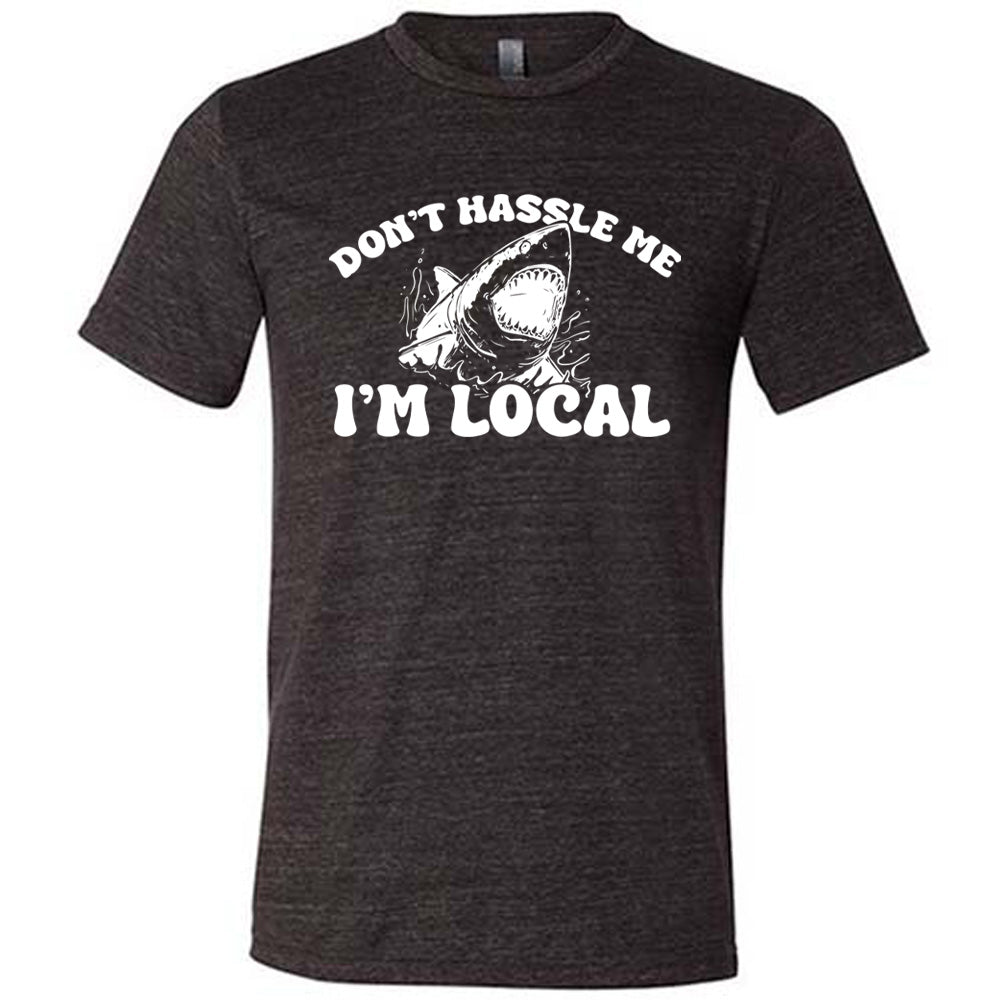 Black colored shirt with a shark graphic on it that says "Don't Hassle Me I'm Local" 