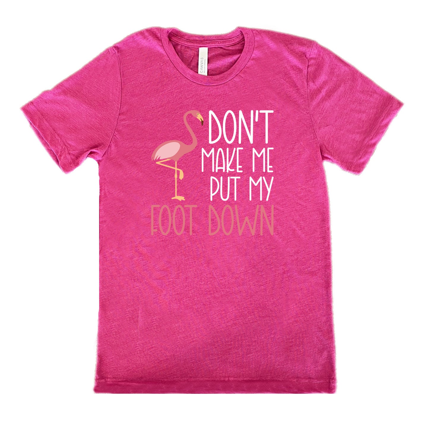 berry unisex tee with the words "don't make me put my foot down" on it, with the graphic of a flamingo next to the words, with its foot raised