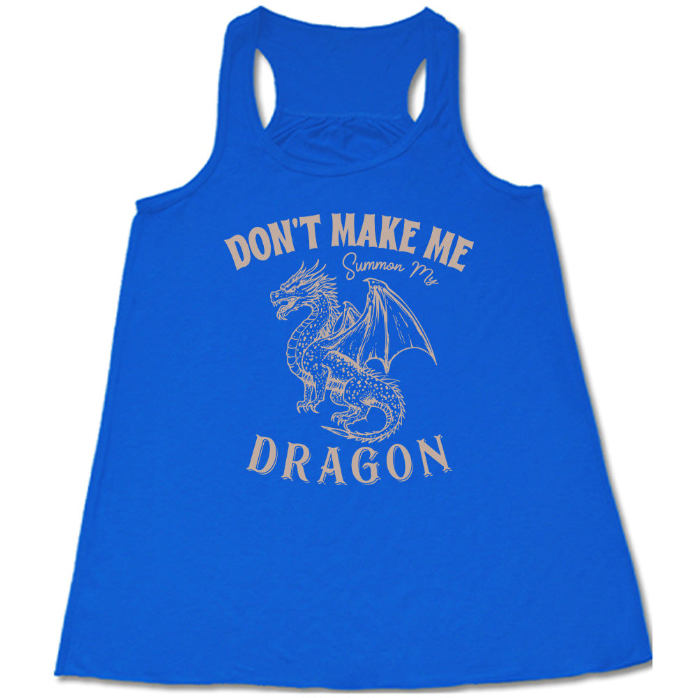 blue racerback flowy tank with the words "don't make me summon my dragon" on it, surrounding the graphic of a fierce-looking dragon