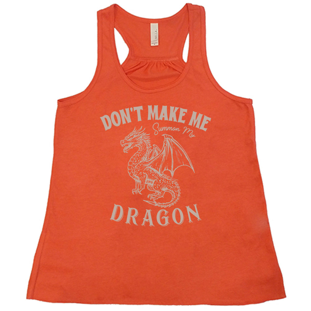 coral racerback flowy tank with the words "don't make me summon my dragon" on it, surrounding the graphic of a fierce-looking dragon