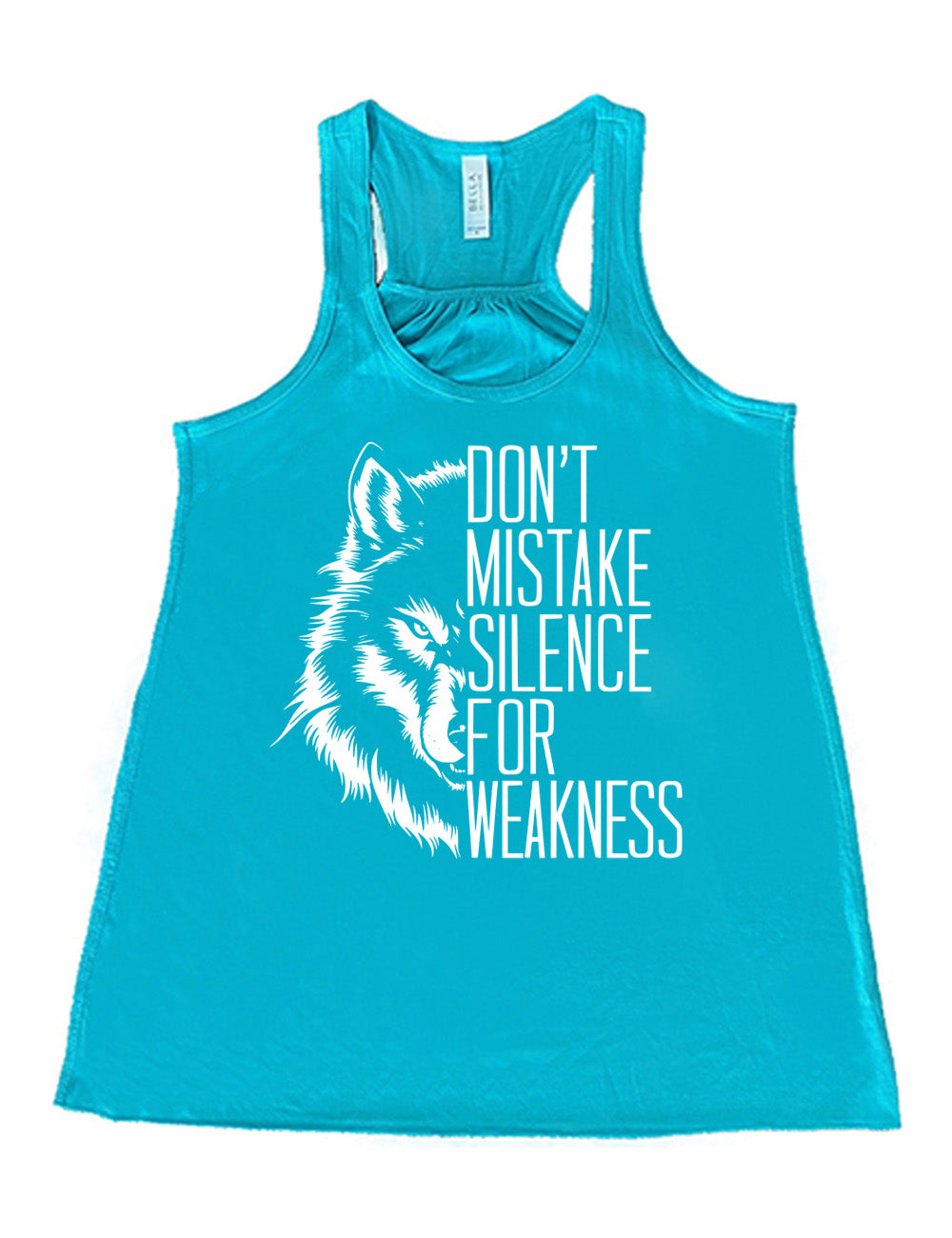 teal flowy racerback tank with the graphic of half a wolf's head, and the words "don't mistake silence for weakness" making up the other half