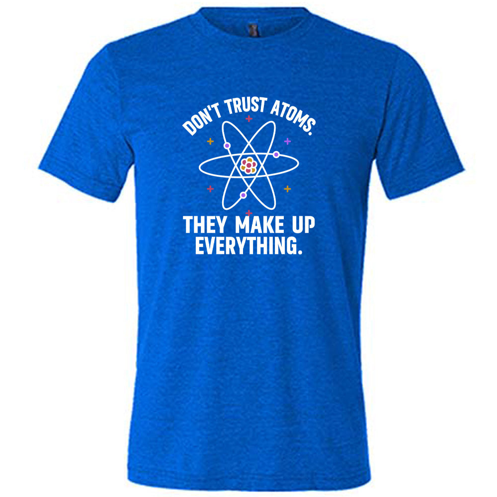 Blue colored shirt with atom graphic on it that says "Don't Trust Atoms. They Make Up Everything."