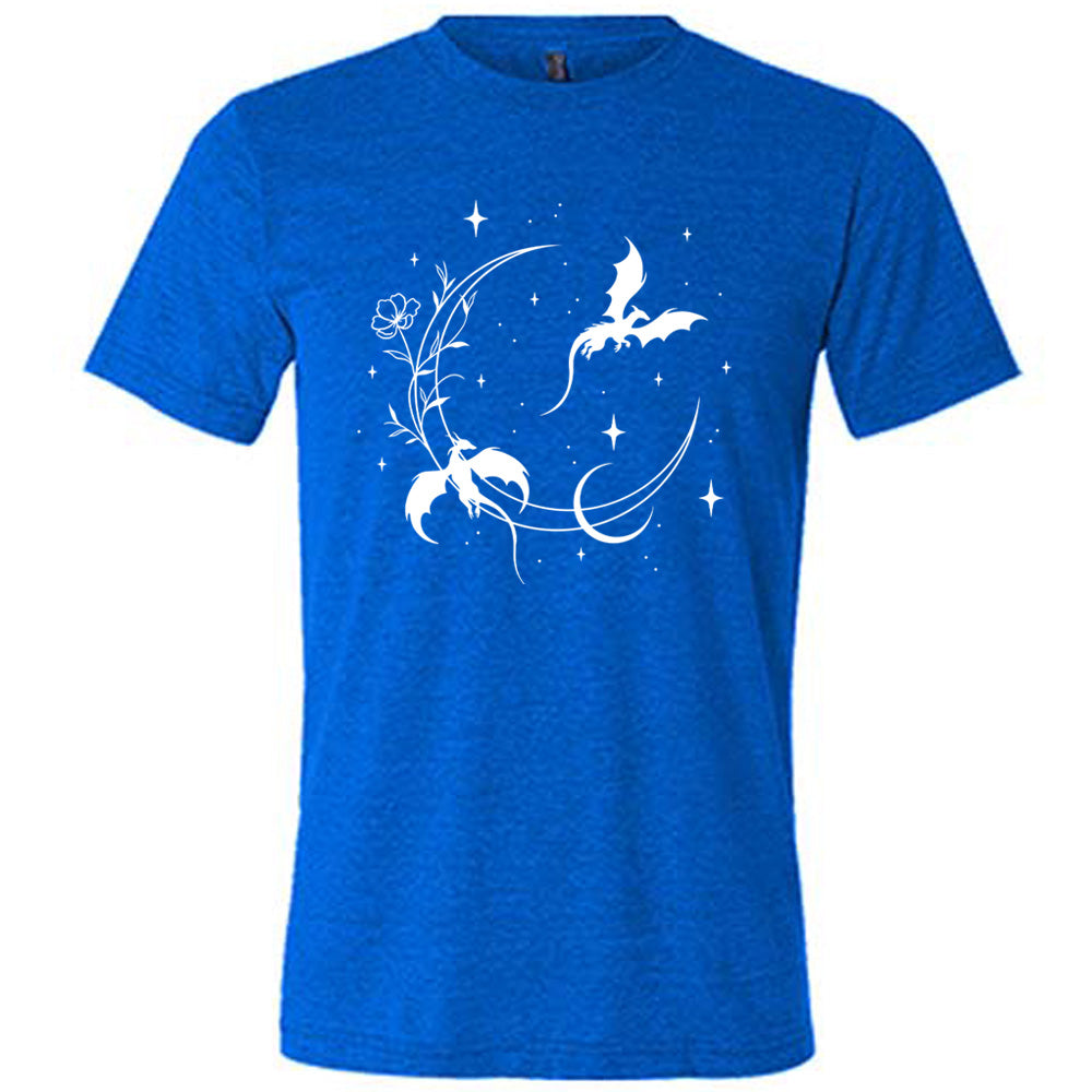 blue unisex tee with the graphic of a large crescent moon, with a flower lining it, two dragons flying, another smaller moon,  and many small stars