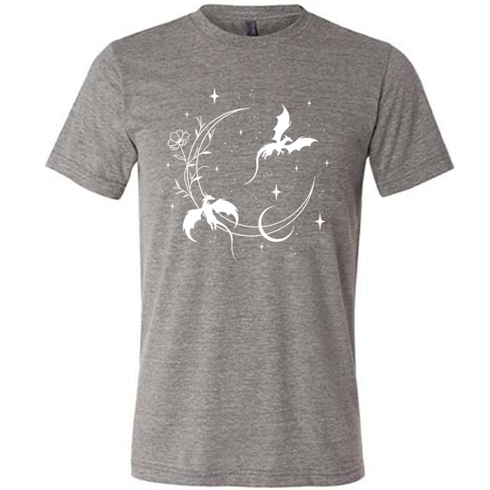 grey unisex tee with the graphic of a large crescent moon, with a flower lining it, two dragons flying, another smaller moon,  and many small stars