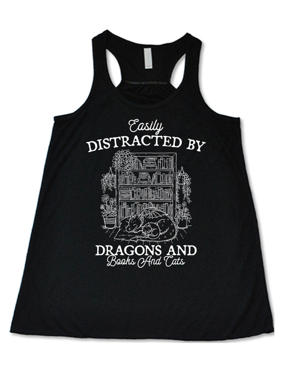 black flowy racerback tank with words on it saying "Easily distracted by dragons and books and cats" around the graphic of a detailed large, full bookcase, with plants hanging and placed beside it, and a dragon curled up in front of it