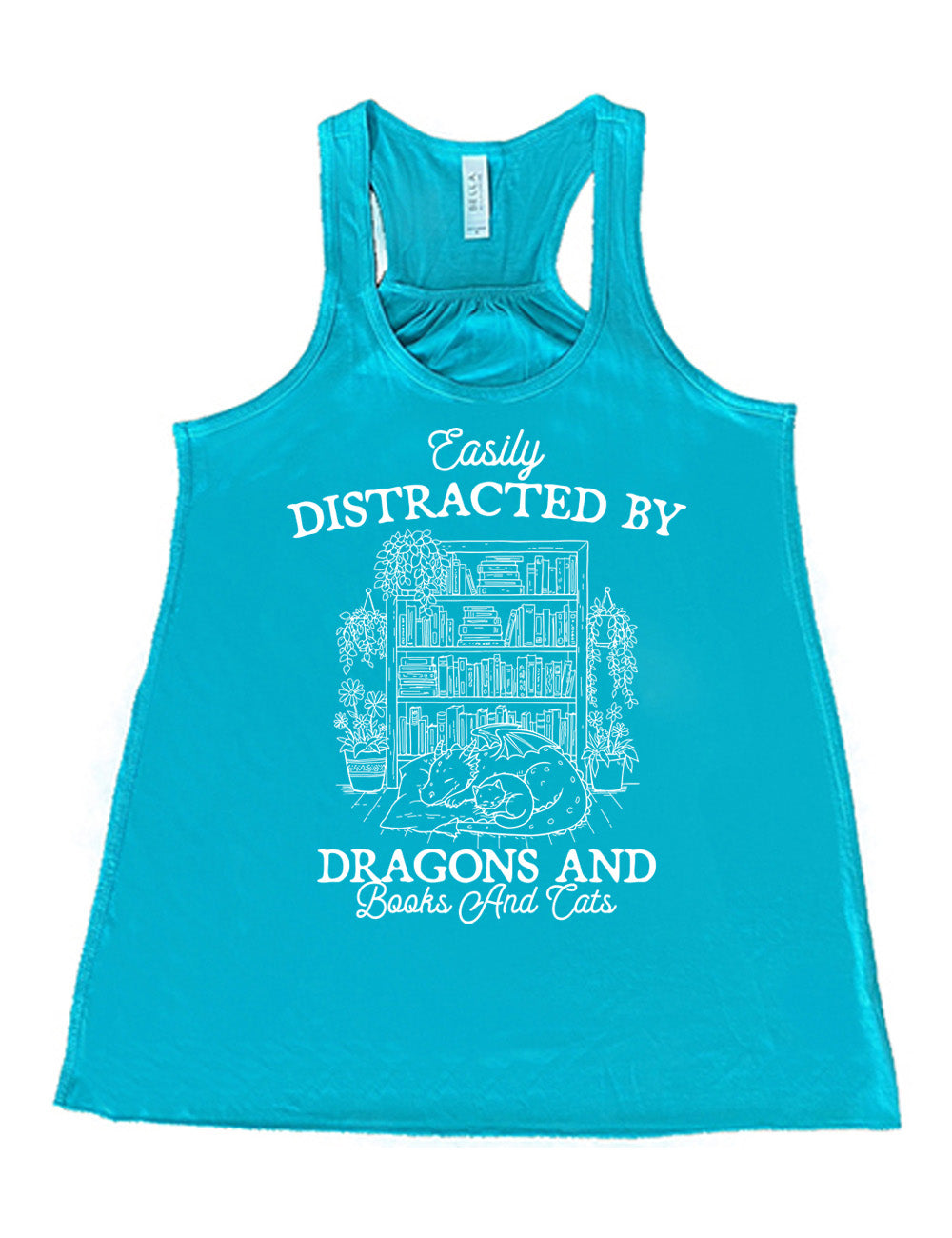 teal flowy racerback tank with words on it saying "Easily distracted by dragons and books and cats" around the graphic of a detailed large, full bookcase, with plants hanging and placed beside it, and a dragon curled up in front of it