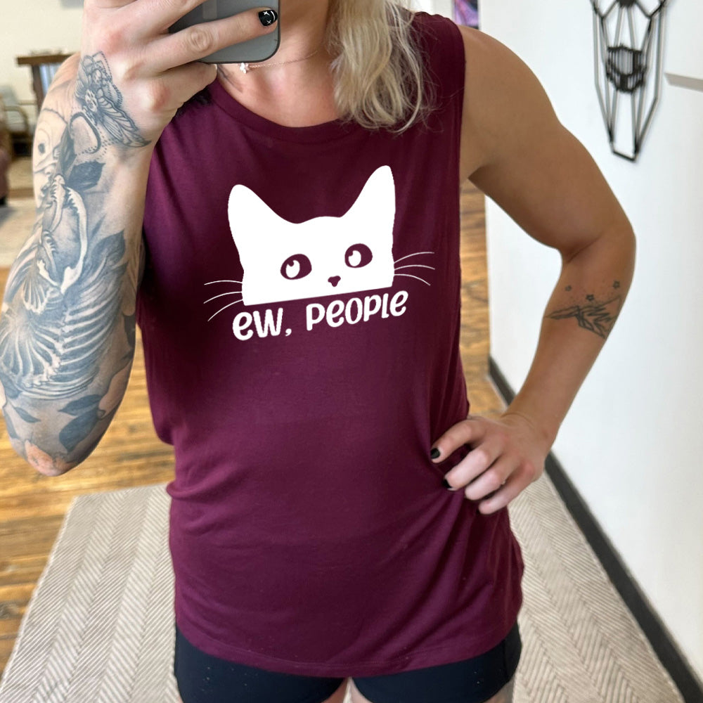 Model wearing maroon colored muscle tank with cat rolling eyes graphic on it that says "ew, people"