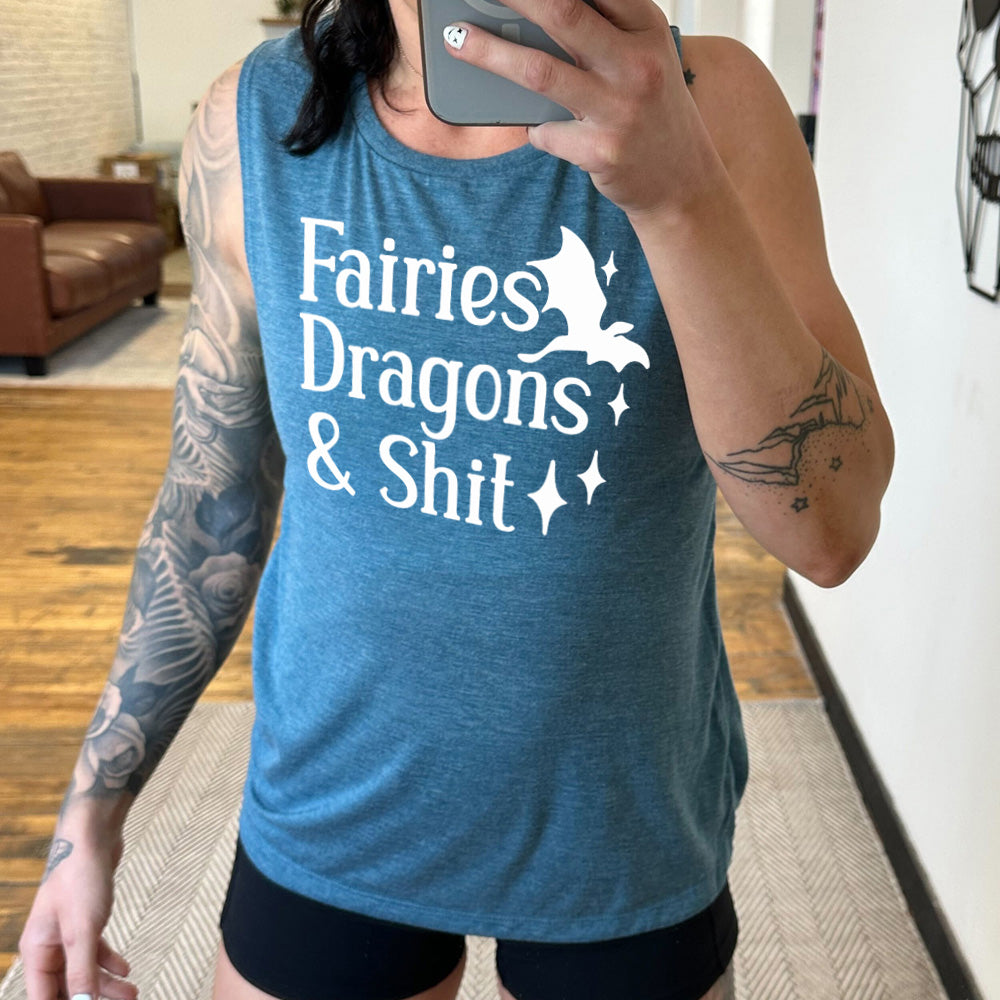 deep teal muscle tank with the words "fairies dragons & shit" on it, with the small graphic of a dragon and a few stars