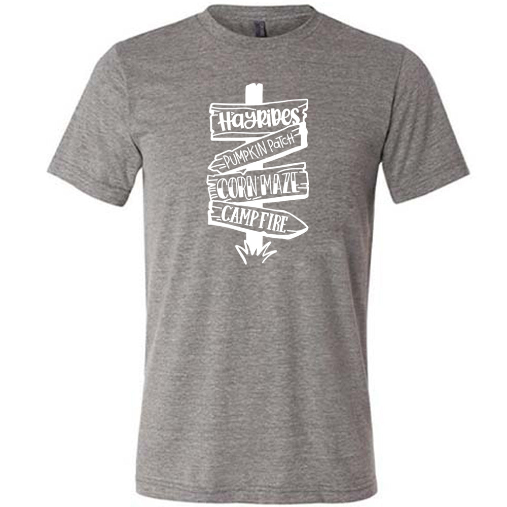 Grey colored shirt with fall activities signpost graphic on it that says "Hayrides, Pumpkin Patch, Corn Maze, Campfire"