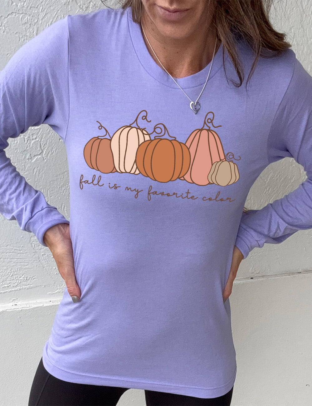 heather dark lavender long sleeve shirt with the graphic of five pumpkins of varied shape and color, and the small words underneath saying "fall is my favorite color"