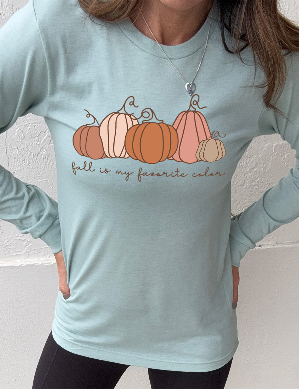 heather dusty blue long sleeve shirt with the graphic of five pumpkins of varied shape and color, and the small words underneath saying "fall is my favorite color"