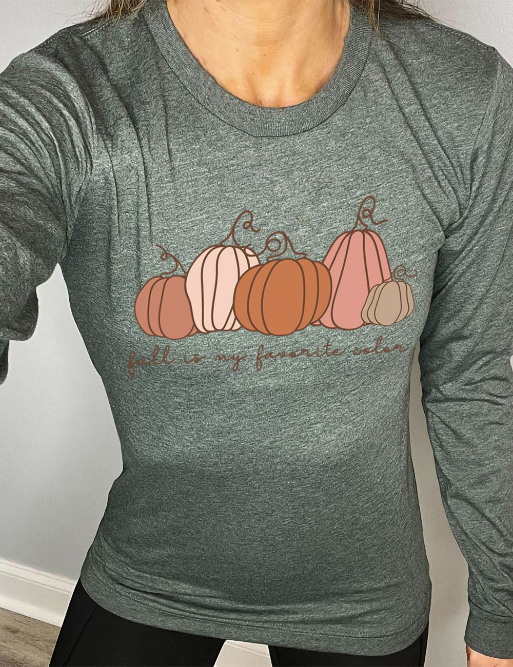 heather forest long sleeve shirt with the graphic of five pumpkins of varied shape and color, and the small words underneath saying "fall is my favorite color"