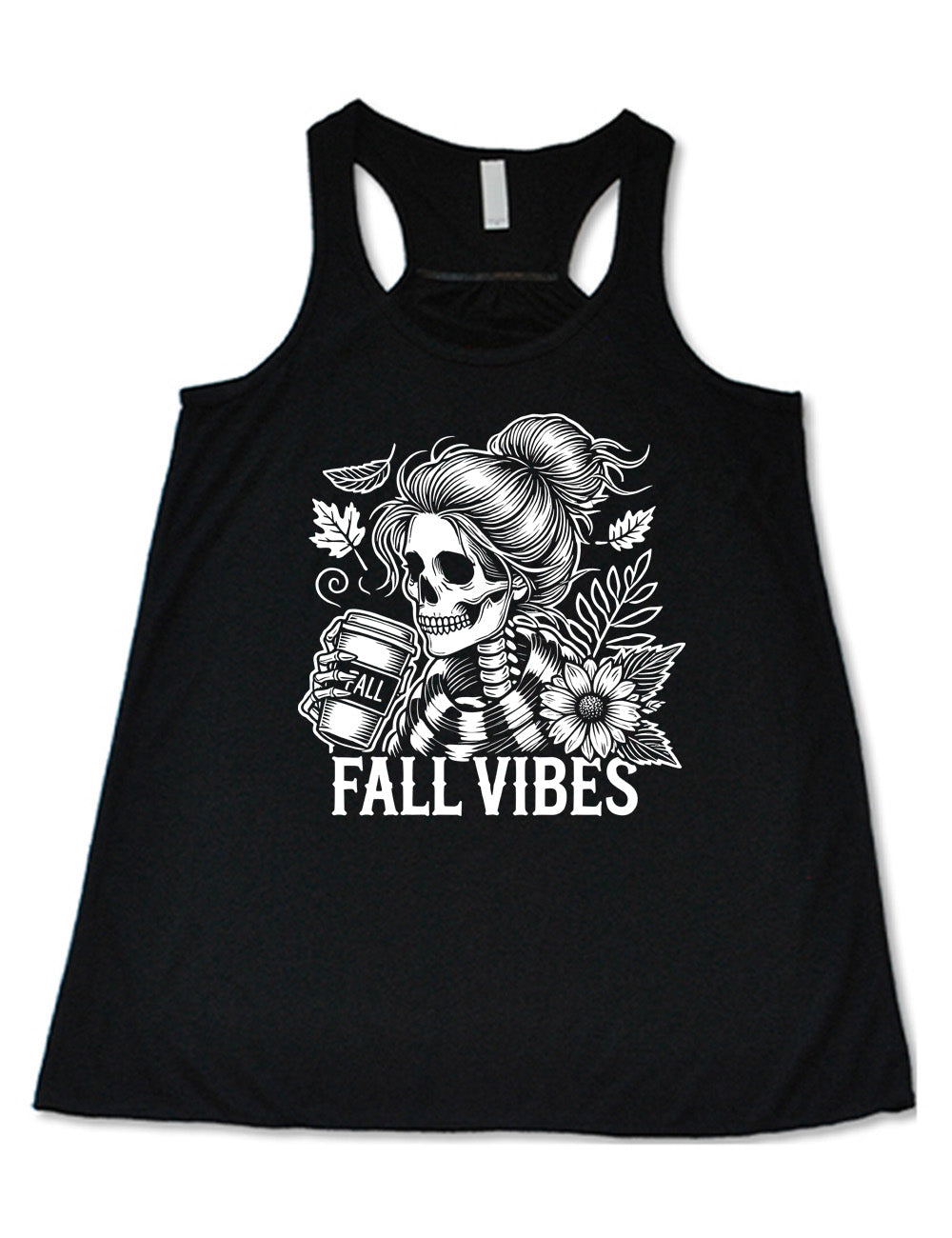 black flowy racerback tank with the graphic of a skeletal woman, with her hair in a bun, holding a takeaway coffee cup labeled "fall", with a flower and leaves next to her, and the words underneath saying "fall vibes"