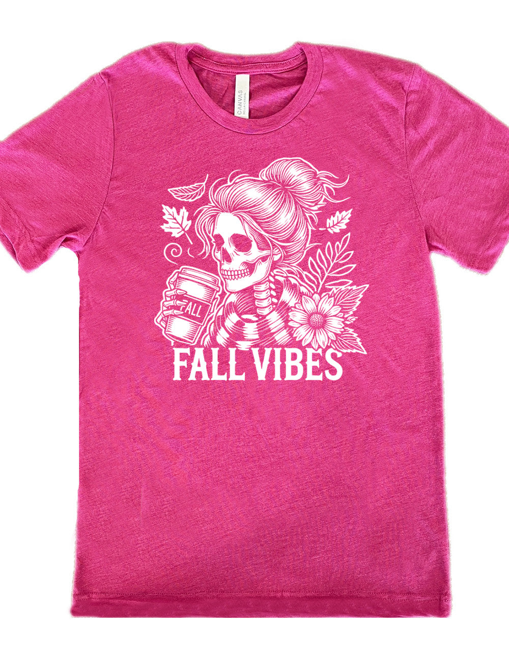 berry unisex tee with the graphic of a skeletal woman, with her hair in a bun, holding a takeaway coffee cup labeled "fall", with a flower and leaves next to her, and the words underneath saying "fall vibes"