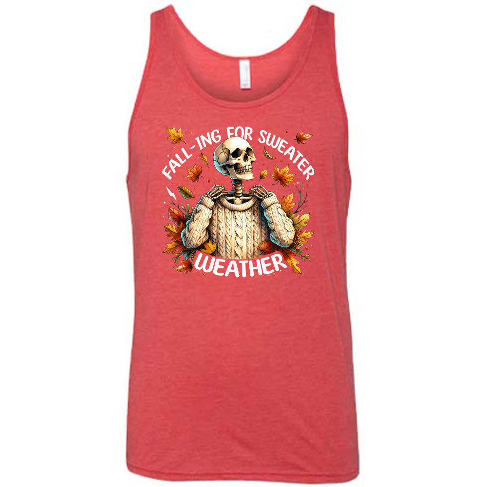 Red colored tank with fall leaves and skeleton wearing a sweater graphic on it that says "Fall-ing For Sweater Weather"