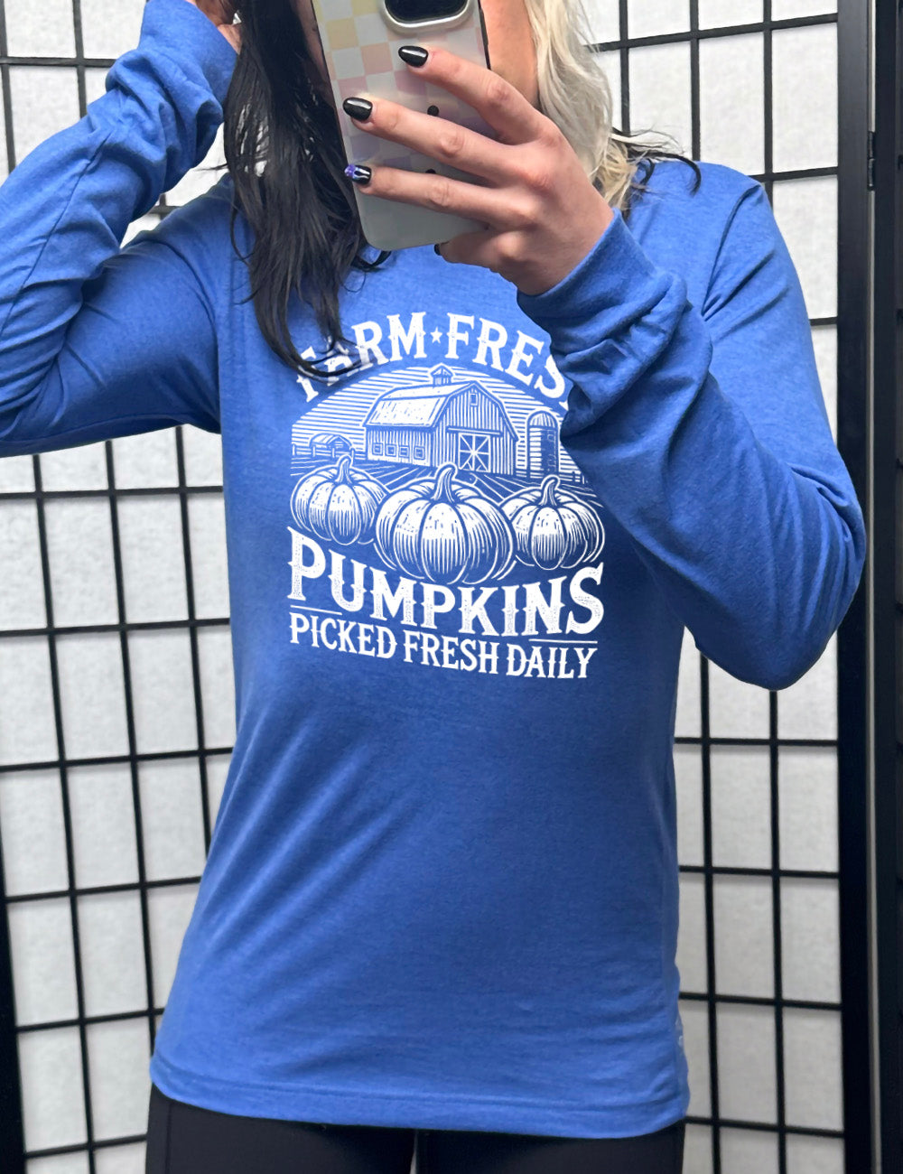 heather true royal long sleeve shirt with the words "farm fresh pumpkins picked fresh daily" around the graphic of a barn in the background and three pumpkins in the foreground