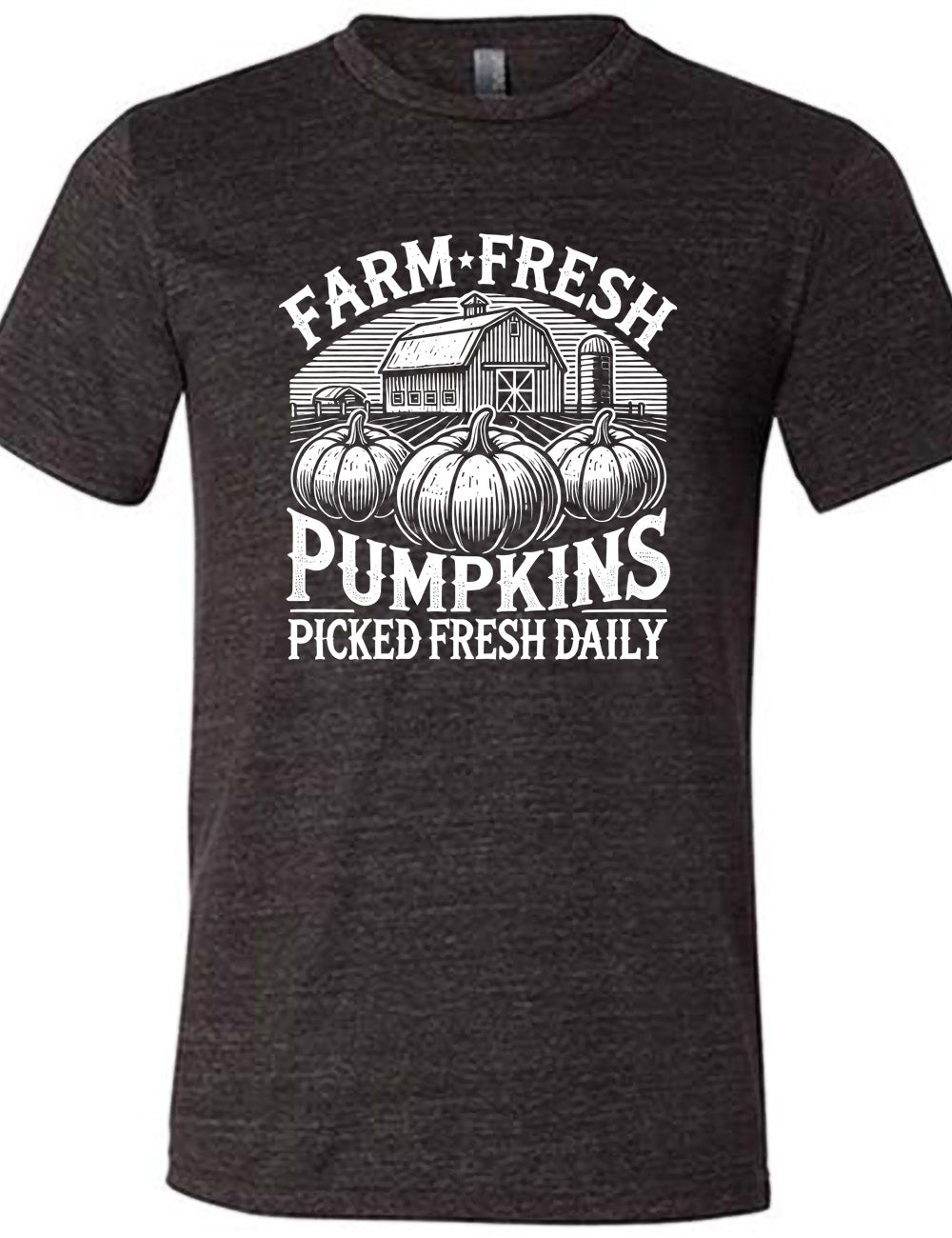 black unisex tee with the words "farm fresh pumpkins picked fresh daily" around the graphic of a barn in the background and three pumpkins in the foreground