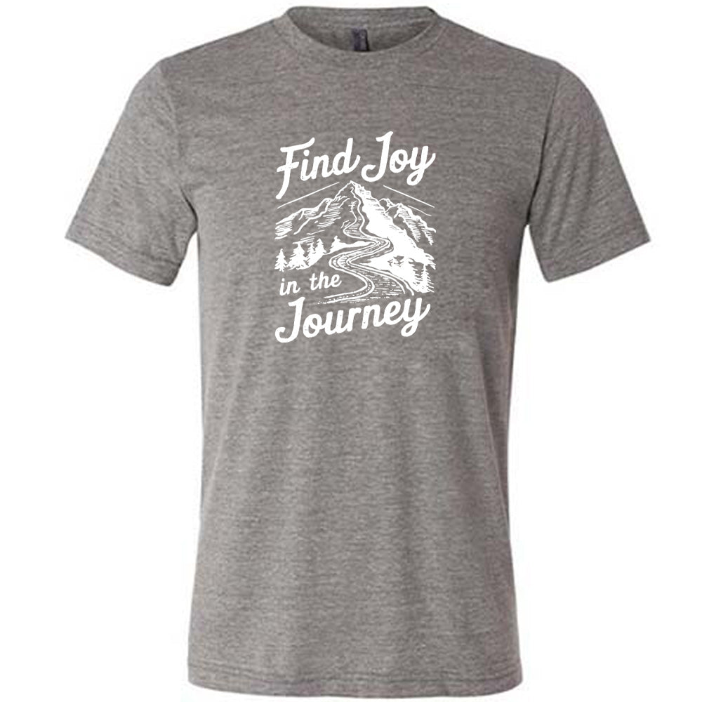Grey colored shirt with a mountain road graphic on it that says "Find Joy In The Journey"