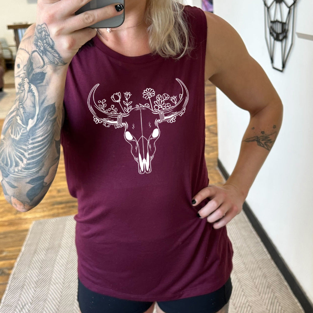maroon colored muscle tank with a floral cow skull graphic on it