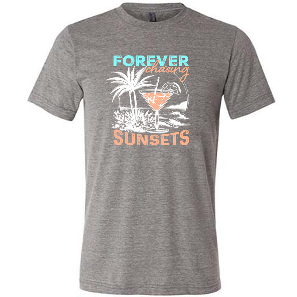 Grey colored shirt with a drink on the beach graphic on it that says "Forever Chasing Sunsets" 