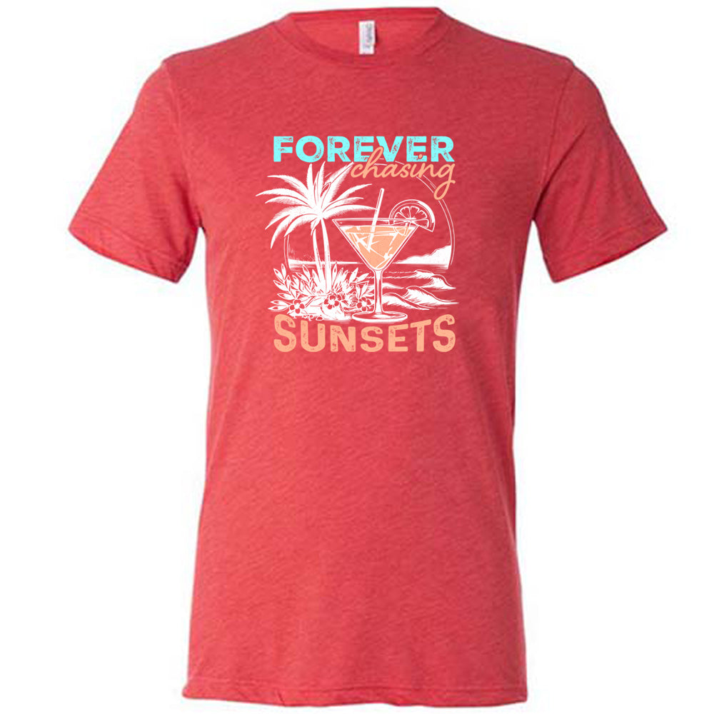 Red colored shirt with a drink on the beach graphic on it that says "Forever Chasing Sunsets" 