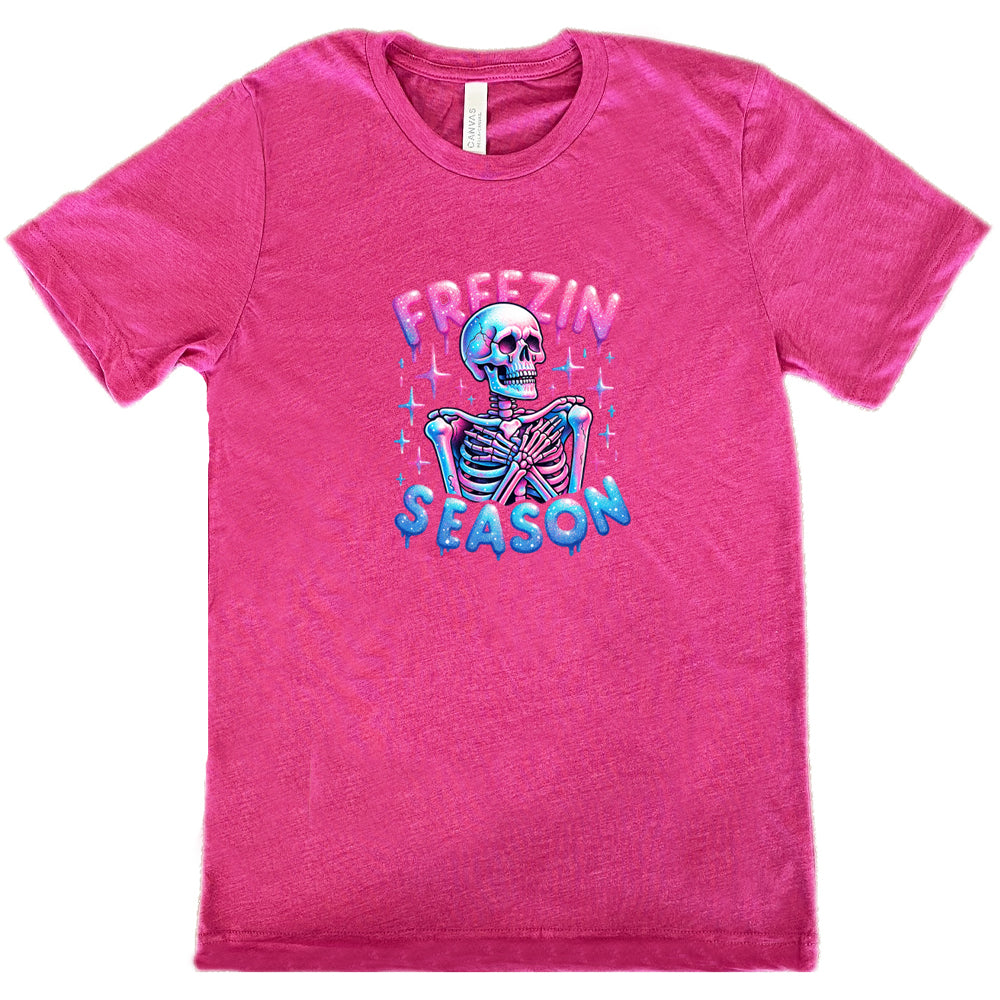 berry shirt with the text "freezin season" with a graphic of a skeleton on it