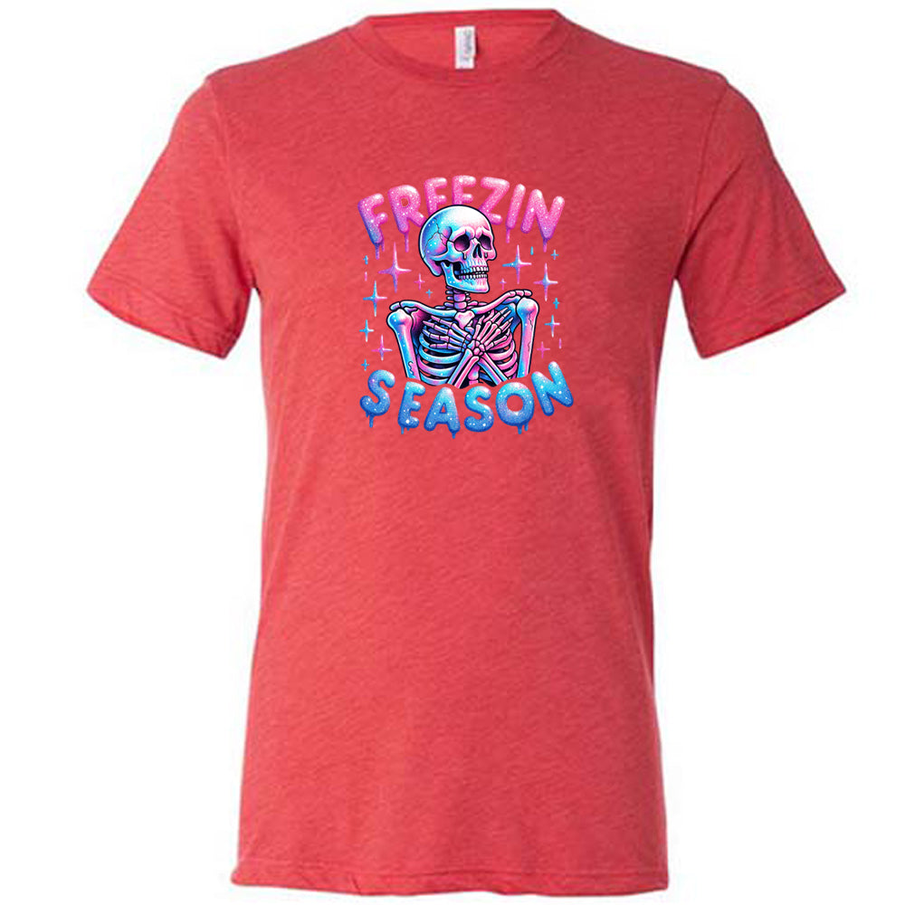 red shirt with the text "freezin season" with a graphic of a skeleton on it