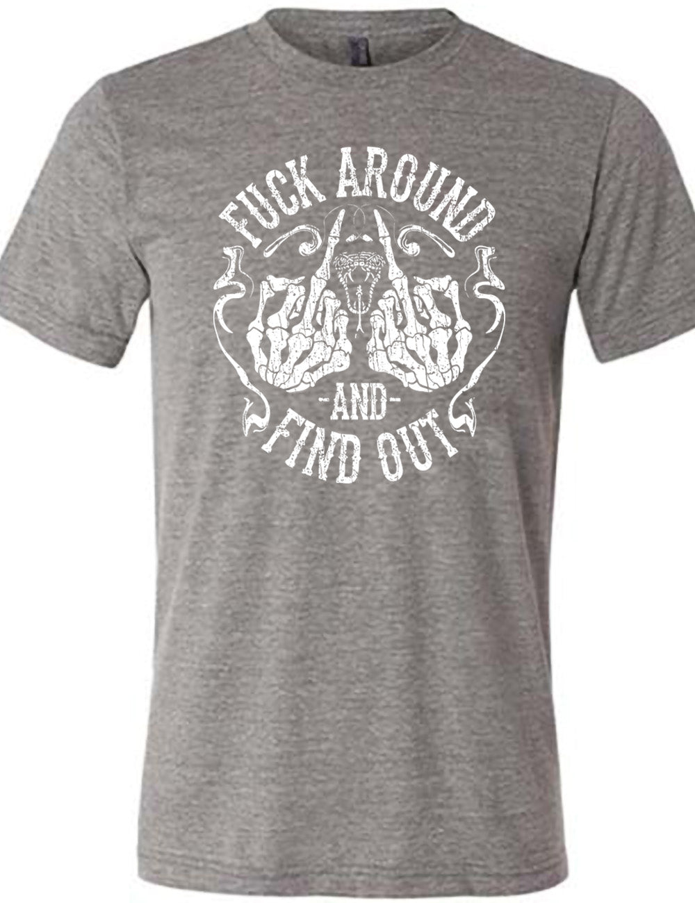 grey unisex tee with the graphic of two skeletal hands both giving the middle finger, around a snake's head with its tongue out, with the words circling around this all saying "fuck around and find out" with smokey lines completing the sides of the circle