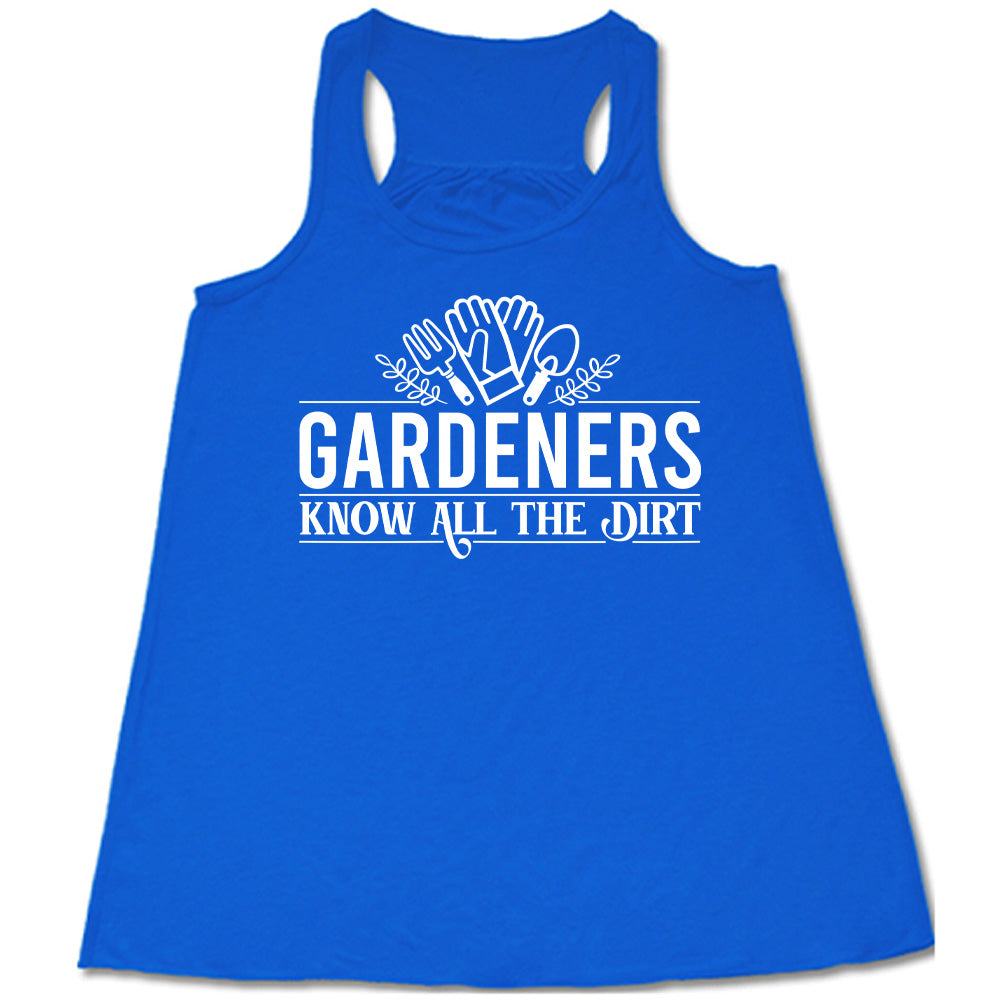 blue flowy racerback tank with the words "gardeners know all the dirt" on it, with the graphic of two gloves and two tools above the words 