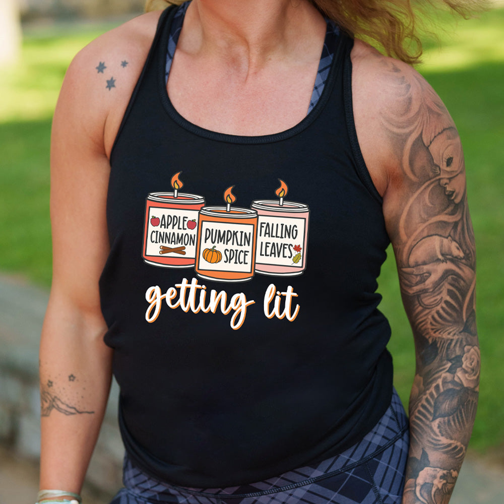 Black colored flowy tank with fall scented candles graphic on it that says "getting lit"