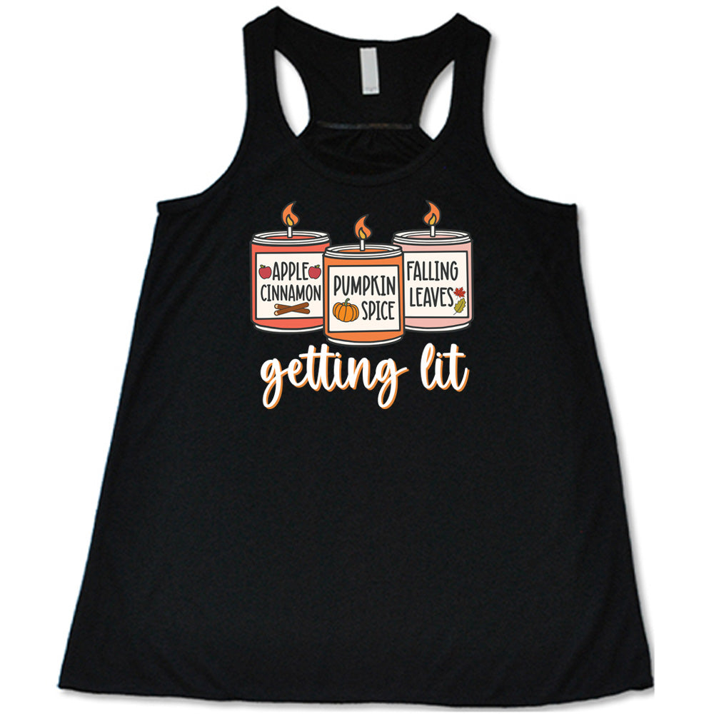 Black colored flowy tank with fall scented candles graphic on it that says "getting lit"