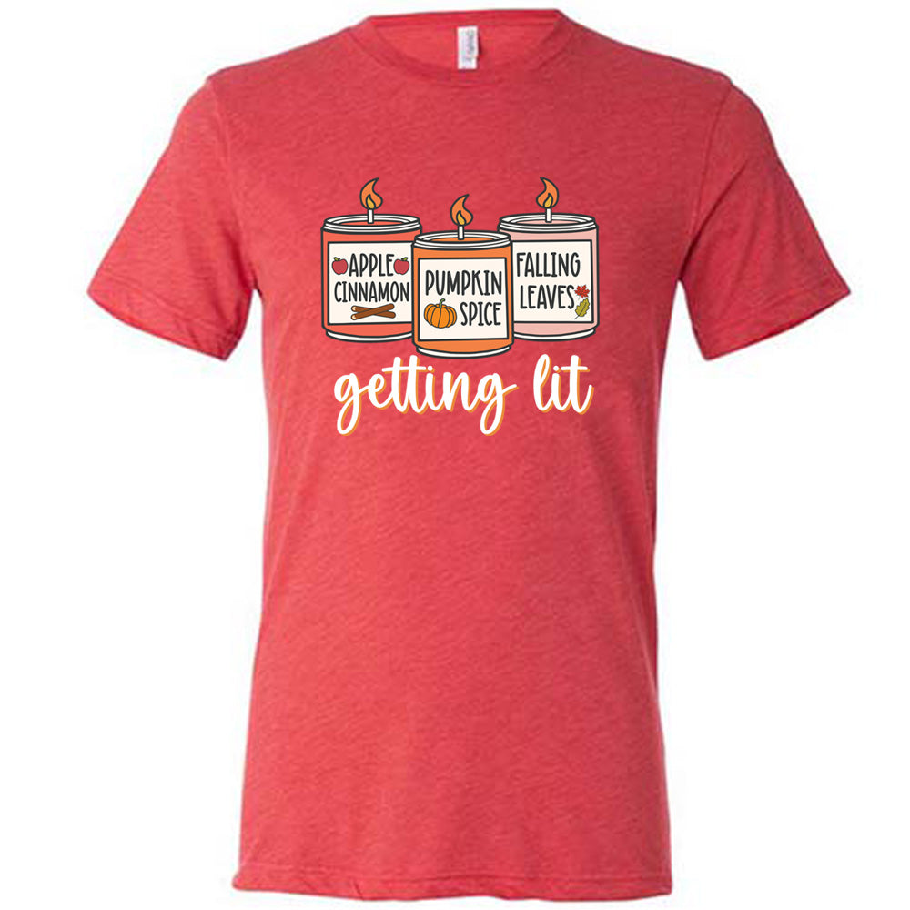 Red colored shirt with fall scented candles graphic on it that says "getting lit" 