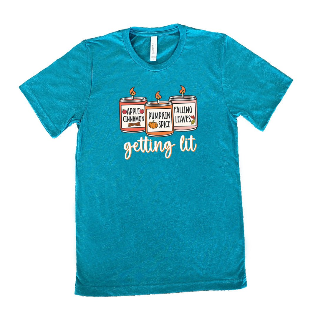 Teal colored shirt with fall scented candles graphic on it that says "getting lit" 