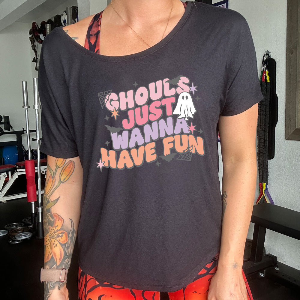 shirt with ghost, spider web, and bats graphic on it that says "Ghouls Just Wanna Have Fun"