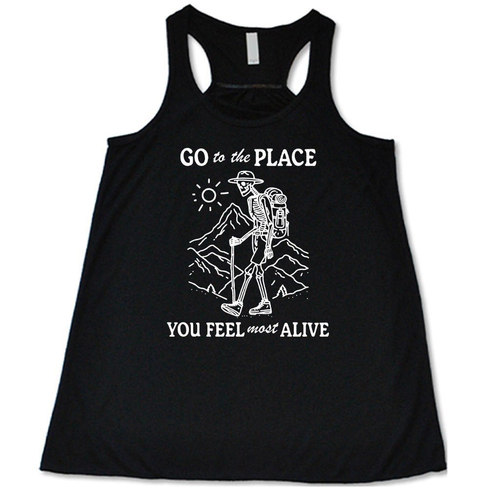 Black colored flowy tank with a skeleton on a hike graphic on it that says "Go To The Place You Feel Most Alive" 