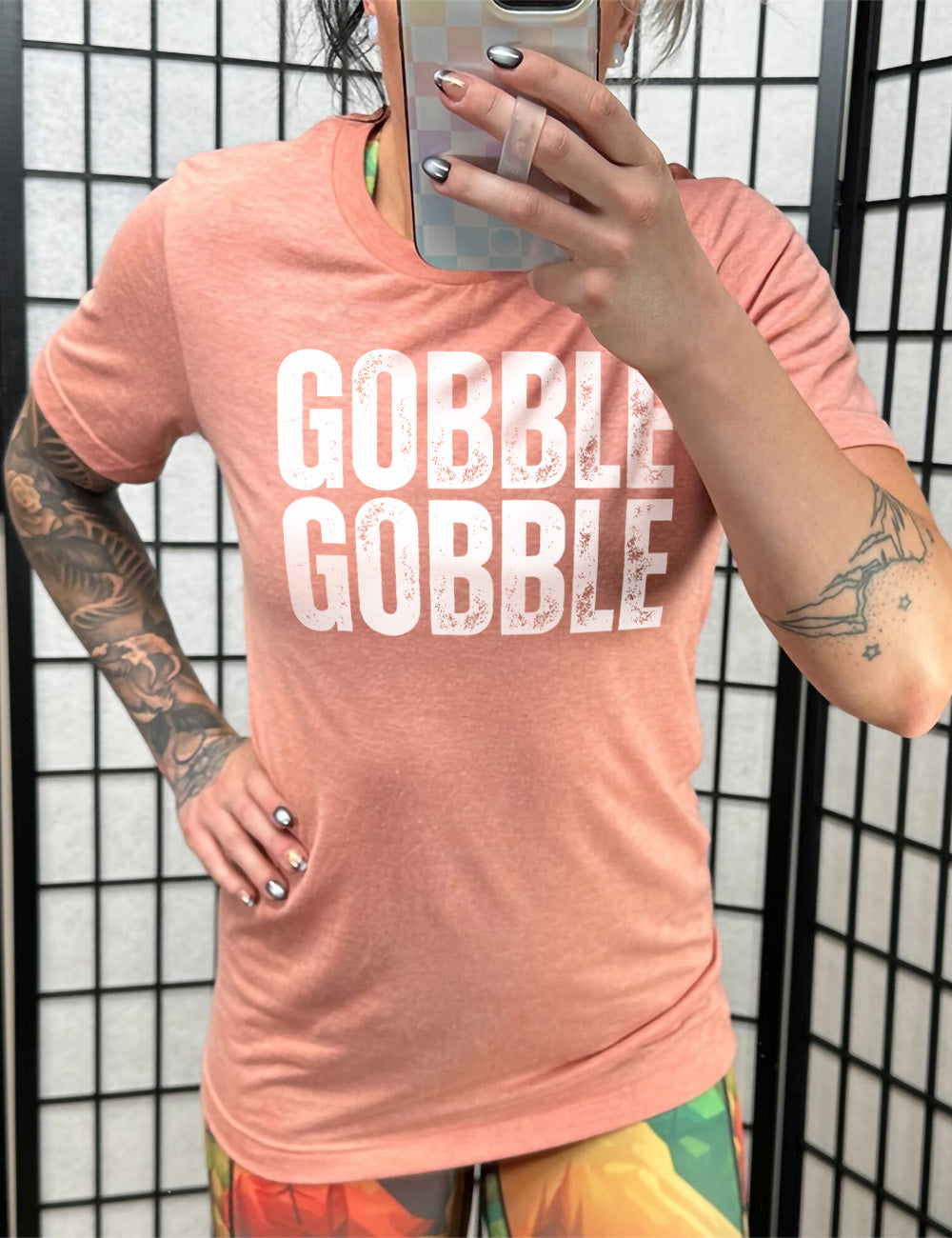 sunset unisex tee with the words "GOBBLE GOBBLE" in slightly grunge font, stacked on top of each other, in all capitals