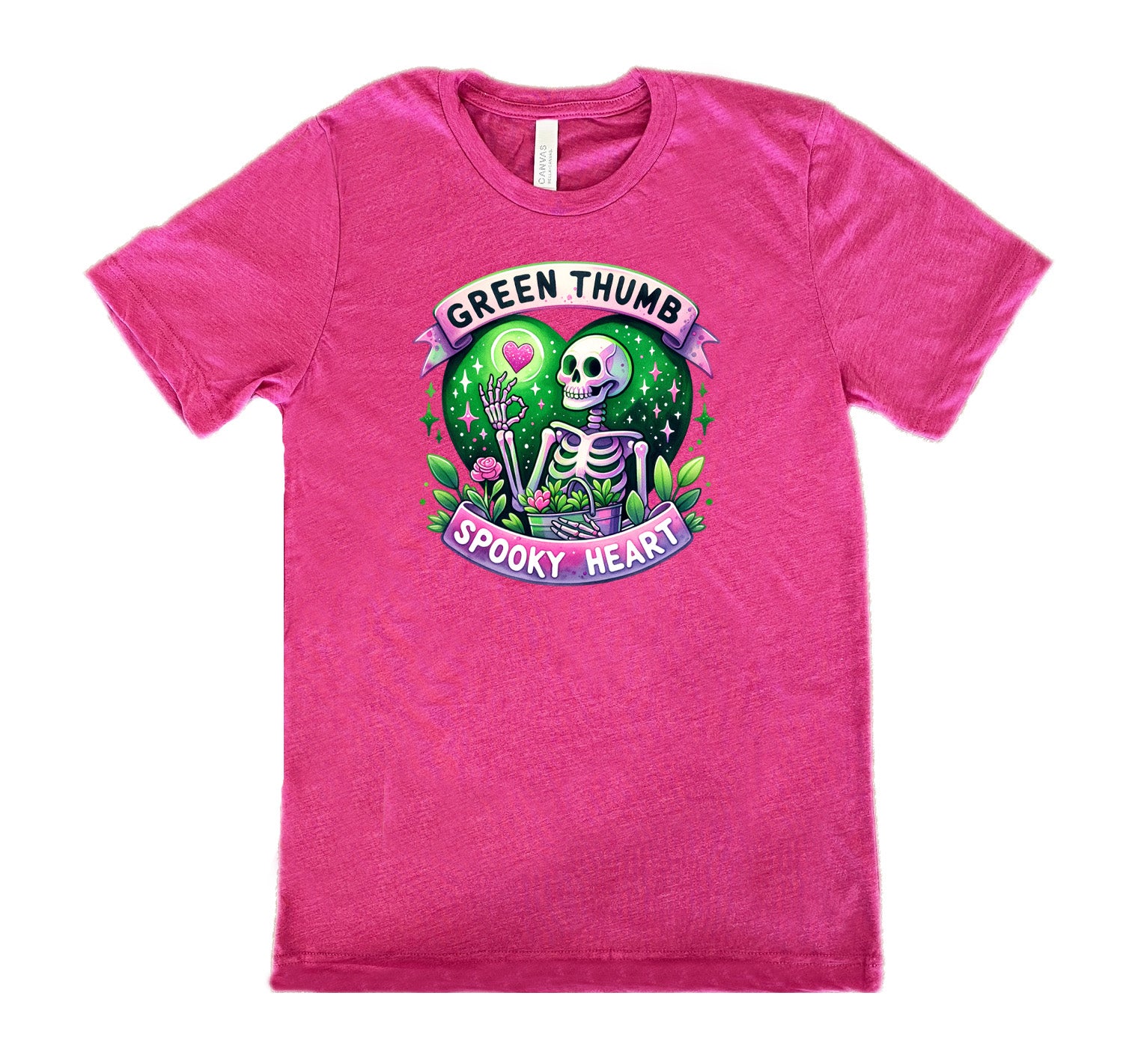 Berry colored shirt with a skeleton and plants graphic on it that says "Green Thumb Spooky Heart"