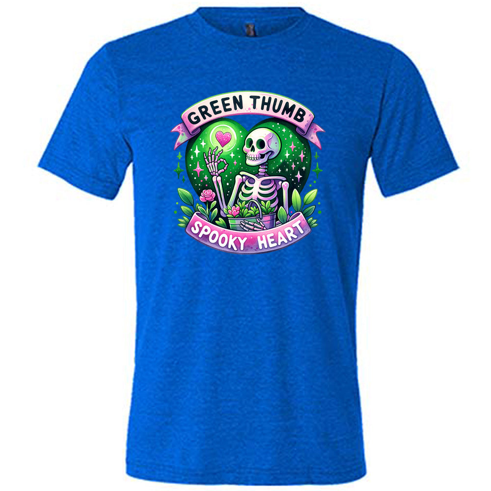 Blue colored shirt with a skeleton and plants graphic on it that says "Green Thumb Spooky Heart"